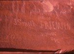 Register Rocks, a sandstone pannel at the head of Cottonwood Canyon where a few of the pioneers engraved their names. The names were destroyed when Lake Powell was filled. Georgy Crampton Photo